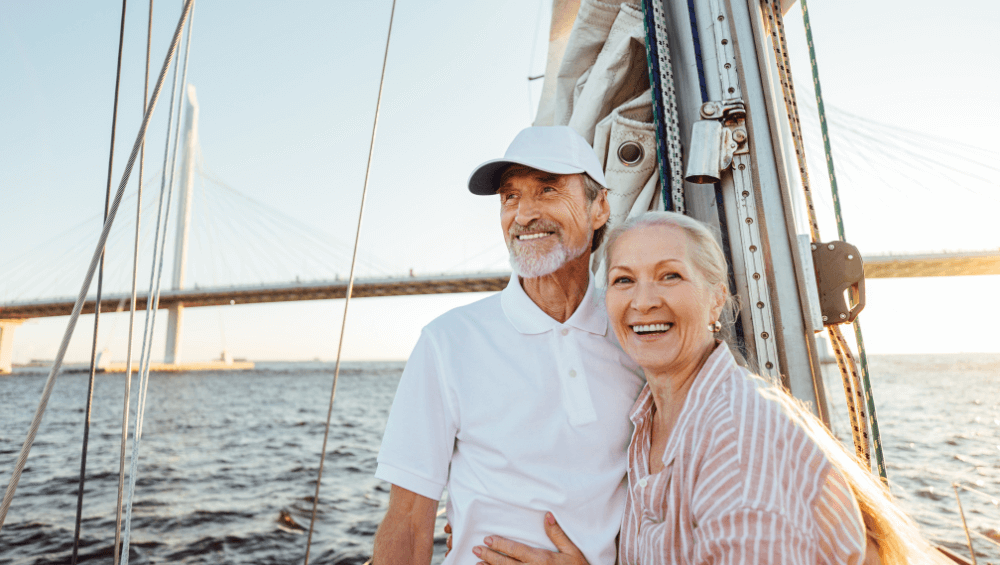 A happy elderly couple on a sailboat