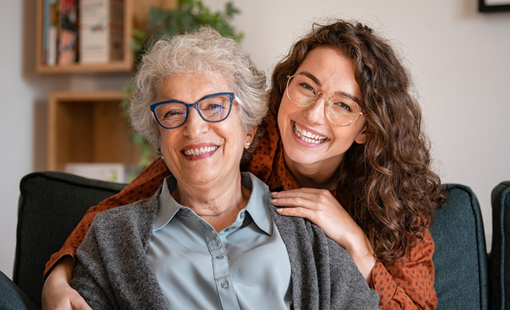 An elderly mother and her adult daughter