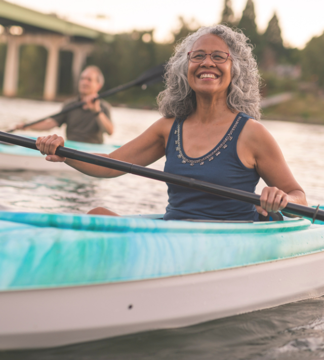 A senior woman in a kayak